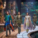 Models displaying future fashion trends blending sustainability, technology, and gender fluidity.
