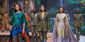 Models displaying future fashion trends blending sustainability, technology, and gender fluidity.